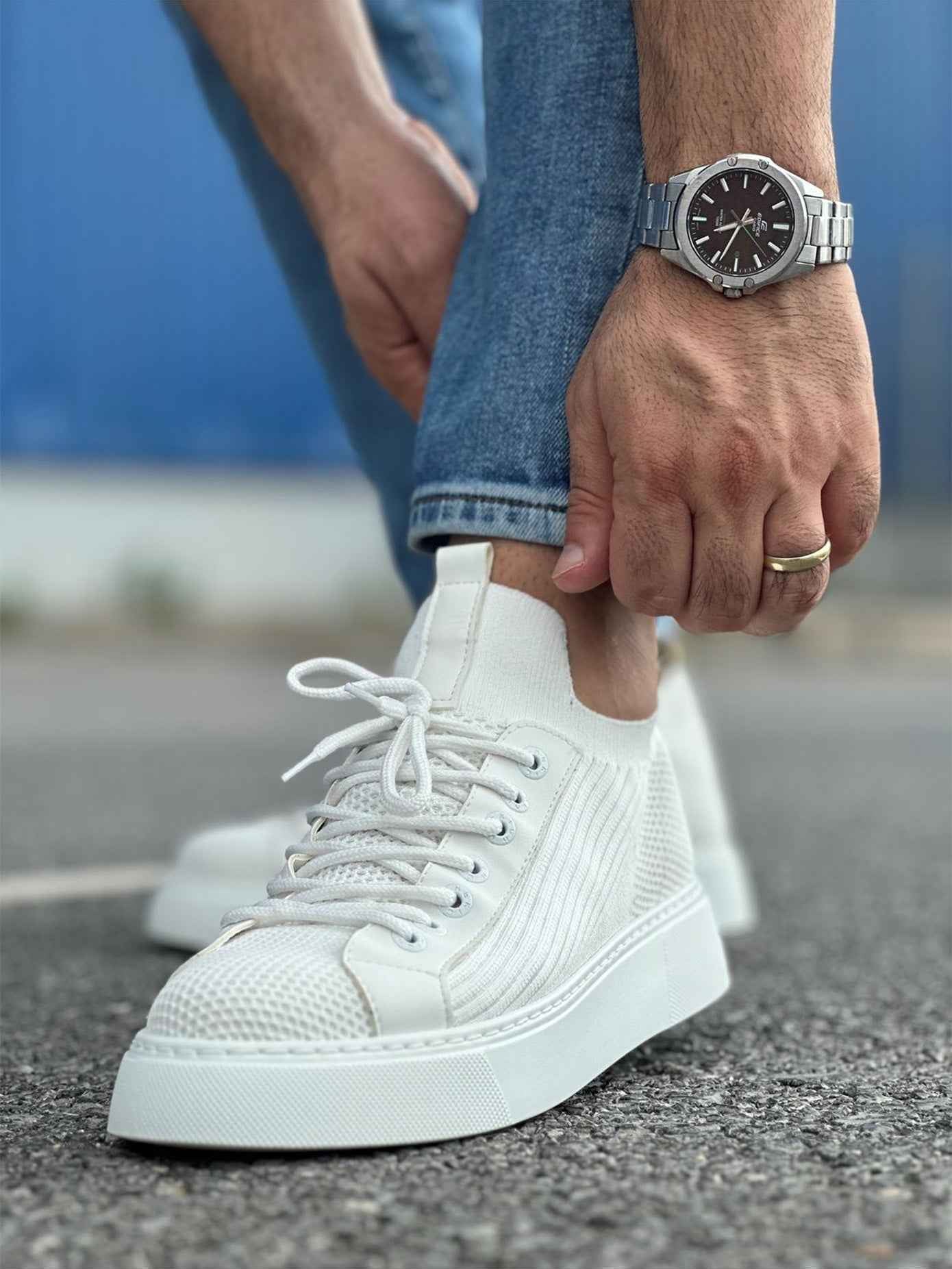 Men's knit white sneakers with lace-up front, textured upper, side view