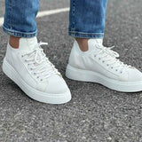 Men's knit white sneakers pair, lace-up front with low-profile sole