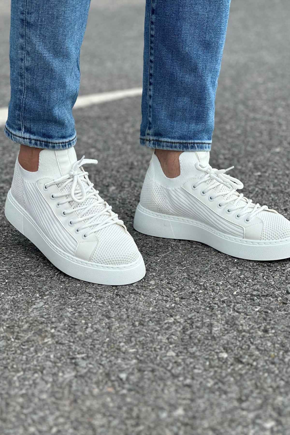 Men's knit white sneakers pair, lace-up front with low-profile sole