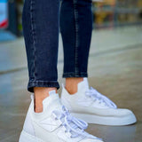 Men's white knit lace-up sneakers with side logo panel and blue laces