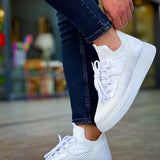 Men's white knit sneakers on-foot, low profile with lace-up front