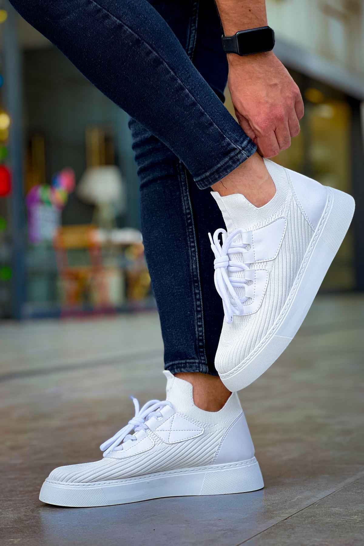 Men's white knit sneakers on-foot, low profile with lace-up front