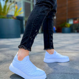 Men's white knit sneakers with round toe and thick sole, side view