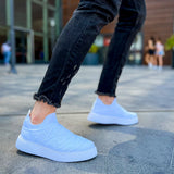 Men's white knit sneakers with elastic-like slip fit and clean low sole