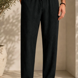 Men's linen pants in dark black, elastic drawstring waist, relaxed ankle-length fit