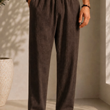Linen pants with elastic drawstring waist, pleated front, tapered legs, dark brown