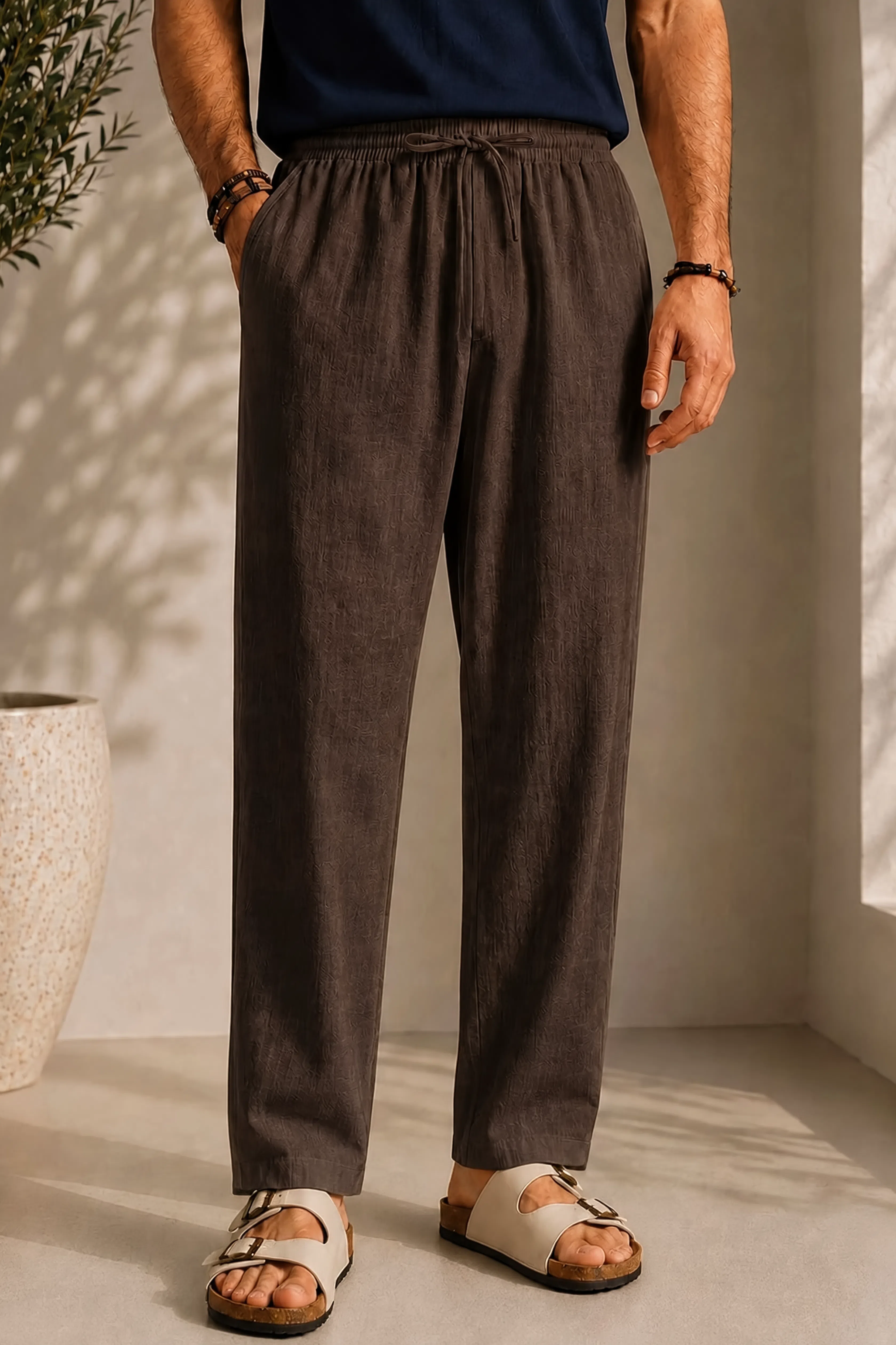Linen pants with elastic drawstring waist, pleated front, tapered legs, dark brown