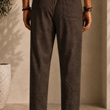 Linen pants, back view: elastic waist, center seam, side pockets, dark brown