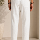 Men's linen pants in white, elastic waistband and front crease, side pocket detail