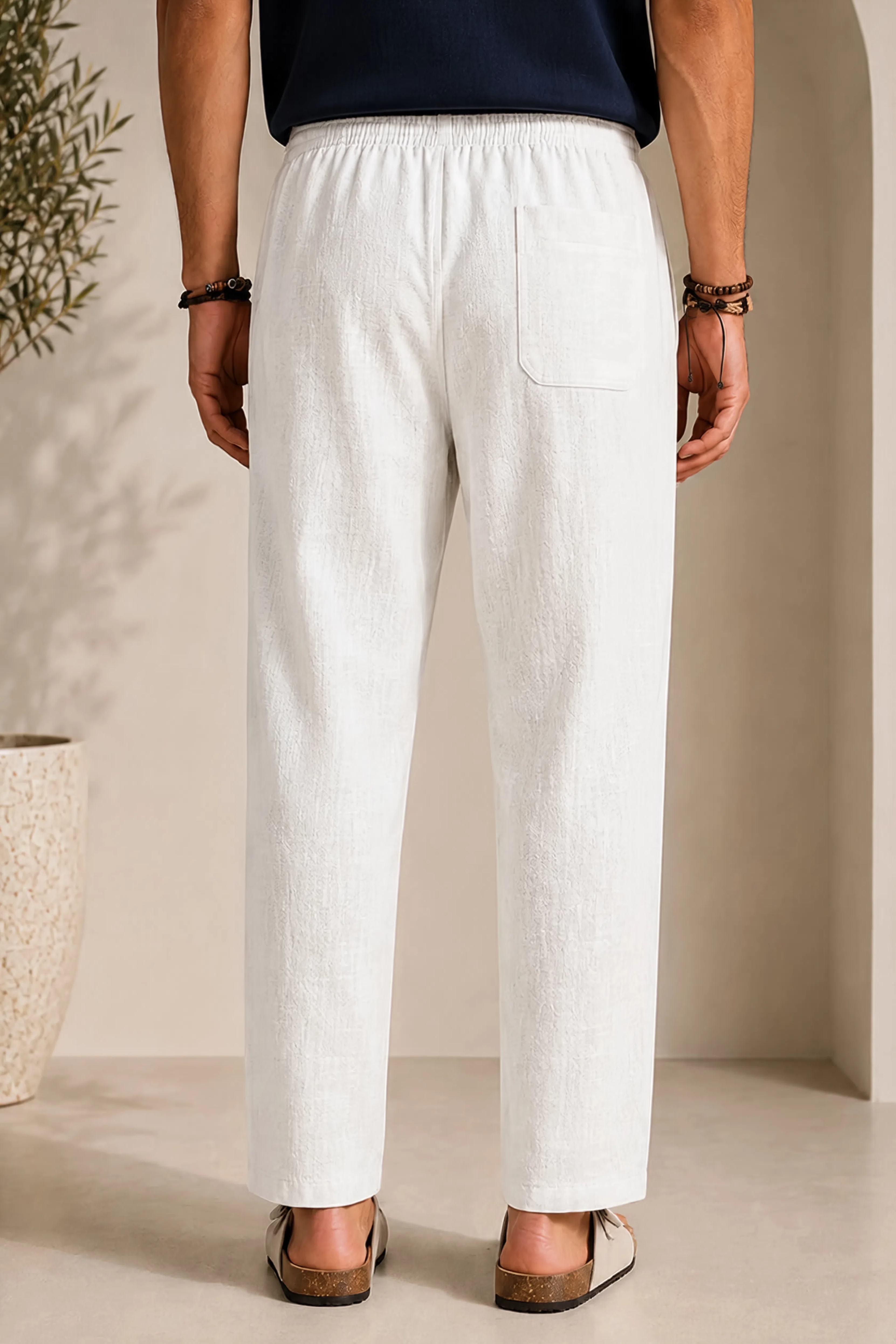 Men's linen pants in white, elastic waistband and front crease, side pocket detail