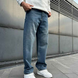 Men's navy baggy denim jeans with relaxed straight legs and side pockets