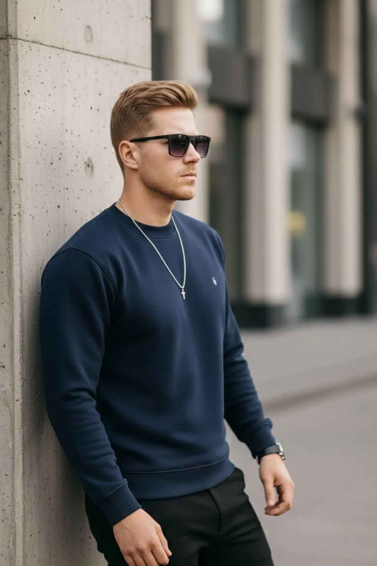 Men's navy crewneck sweatshirt with long sleeves and ribbed cuffs