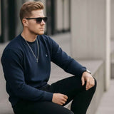 Men's navy crewneck sweatshirt, ribbed hem and cuffs, small chest logo