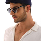 Men's navy blue flat cap close-up, soft crown and curved brim