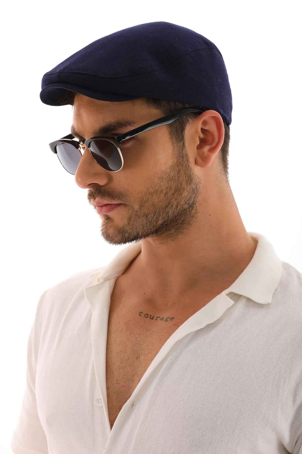Men's navy blue flat cap close-up, soft crown and curved brim