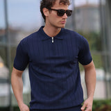 Men's navy knit half-zip polo shirt with ribbed collar and vertical stripe texture