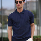 Men's navy half-zip knit polo shirt with short sleeves and zip-front placket