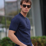 Men's navy polo shirt with short sleeves, ribbed collar, half-zip front