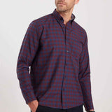 Men's plaid button-up shirt in dark navy with rust-orange check pattern