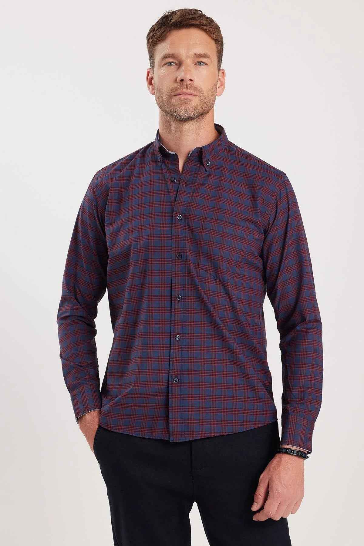Men's plaid button-up shirt in dark navy with rust-orange check pattern; long sleeves