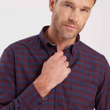 Men's plaid button-up shirt collar in dark navy with rust-orange check pattern