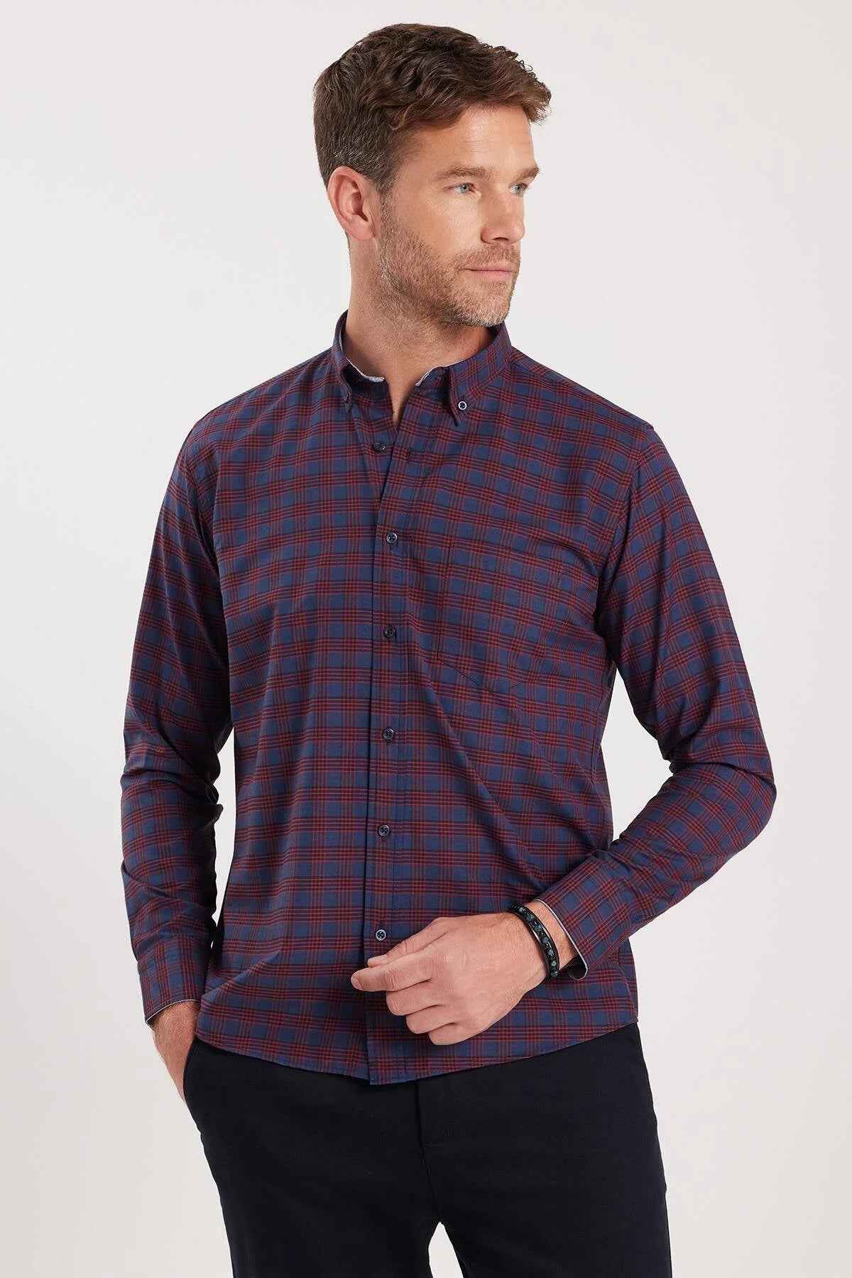 Men's plaid button-up shirt in dark navy with rust-orange checks; side view