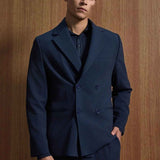 Navy double-breasted suit jacket and trousers, peak lapels