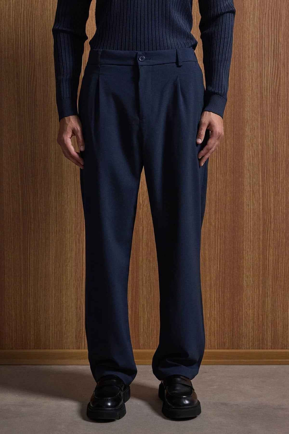 Navy suit trousers with belt loops and straight legs
