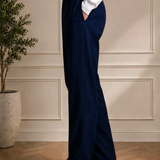 Men's navy blue pleated dress pants, side view, with belt loops, Montivo