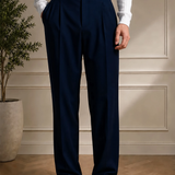 Men's navy blue pleated dress pants, front view, with belt loops, Montivo