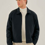 Men's dark blue zip-front jacket with stand collar and ribbed cuffs