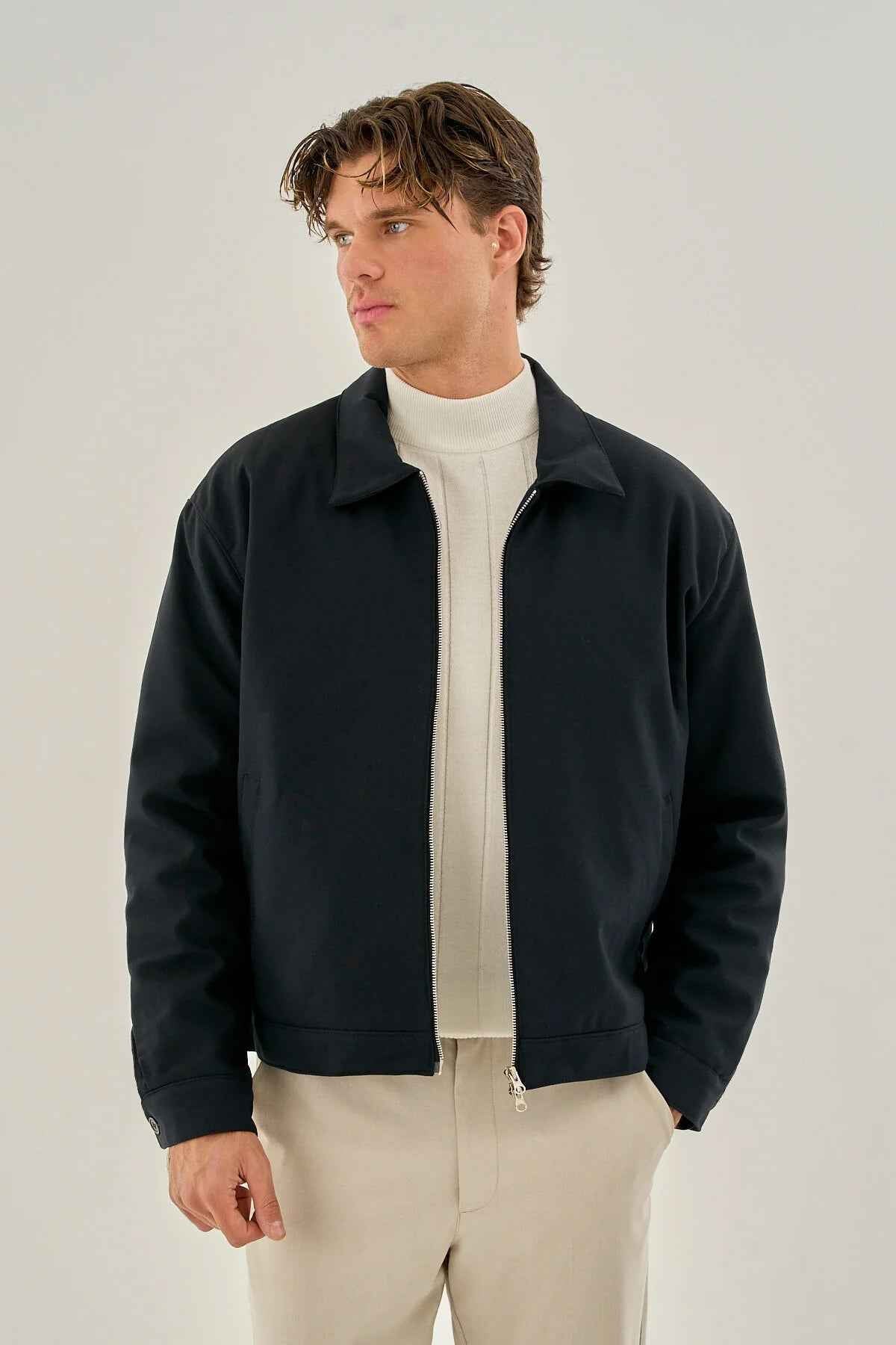 Men's dark blue zip-front jacket with stand collar and ribbed cuffs