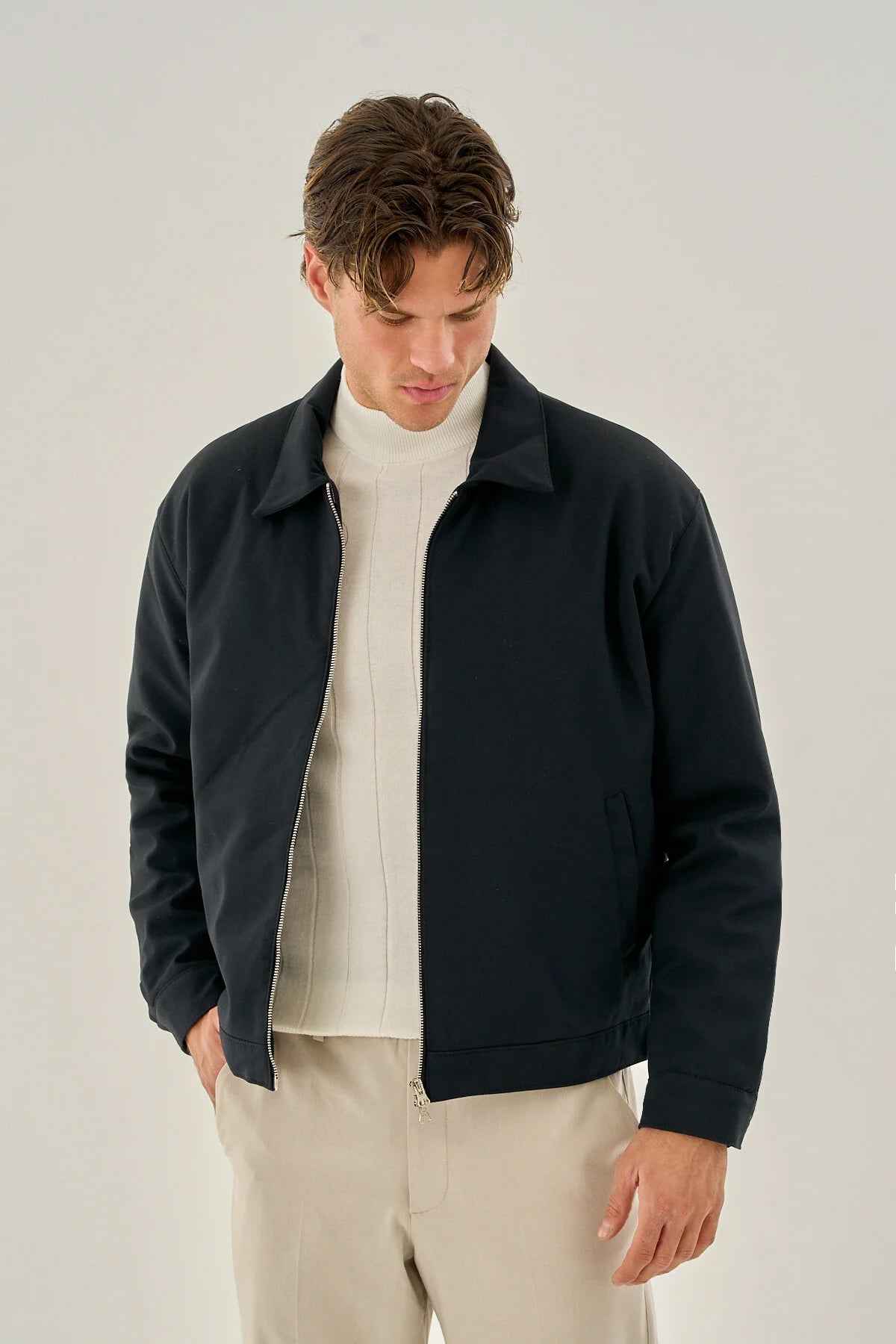Men's dark blue zip-front jacket with stand collar and long sleeves