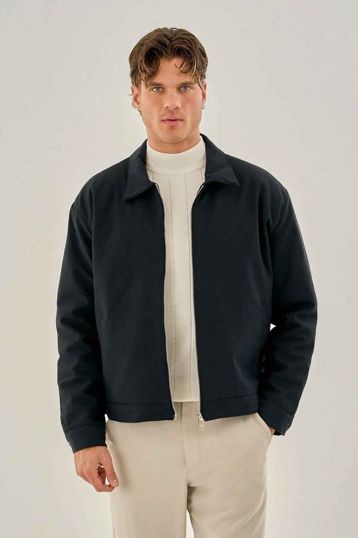 Men's dark blue zip-front jacket with stand collar and ribbed cuffs
