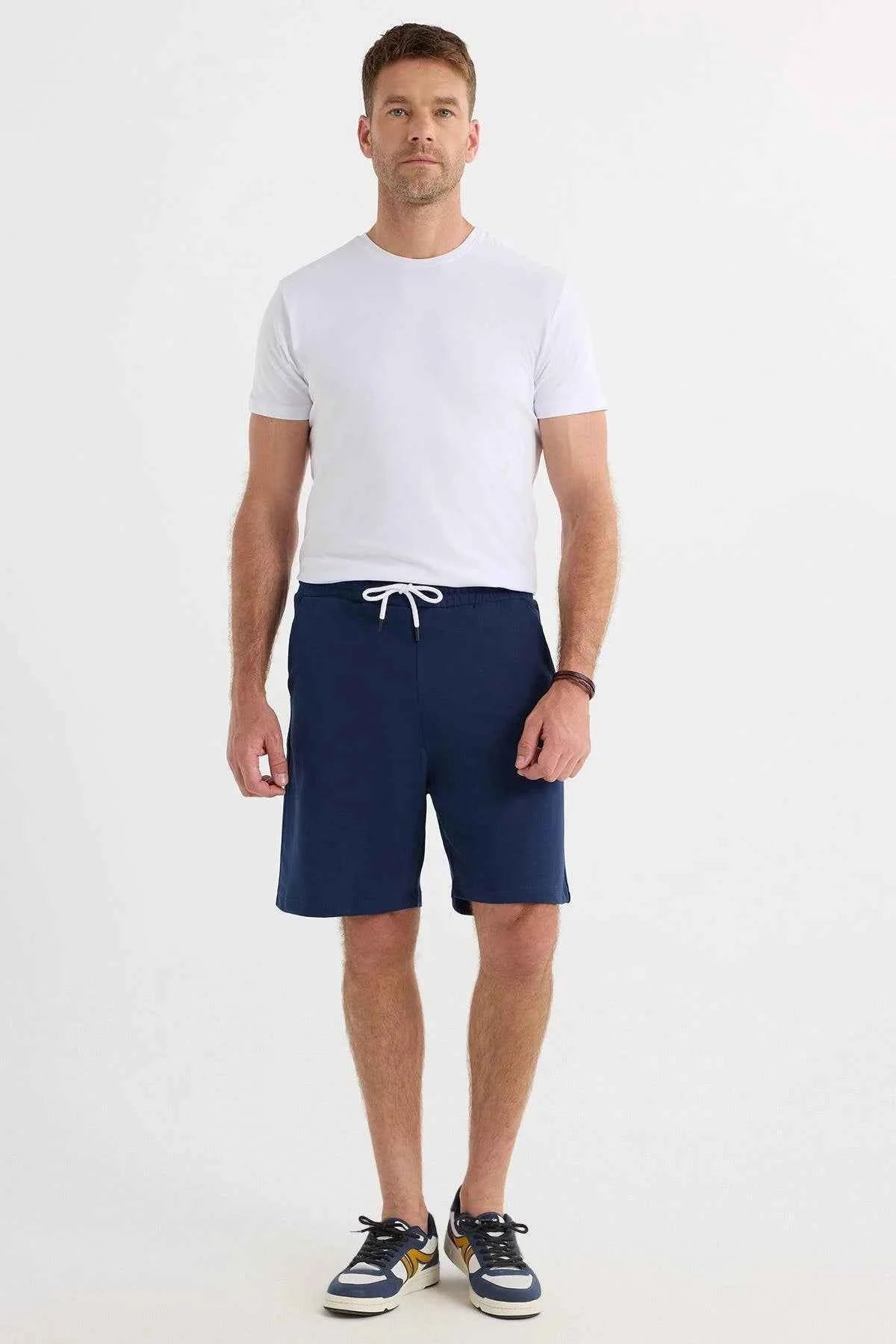 Men's navy blue drawstring shorts with front pockets and straight hem