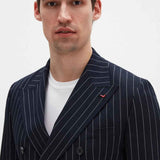 Men's navy pinstripe suit jacket with lapel detail and small chest pin