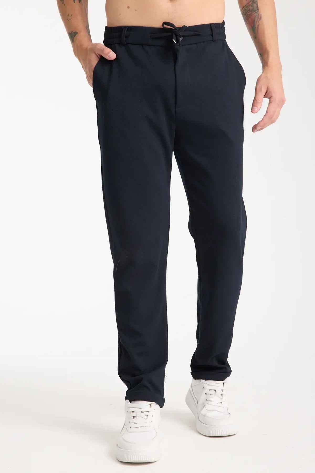 Men's Kaphone dark navy sweatpants with drawstring waist, relaxed straight legs, cuffed hem