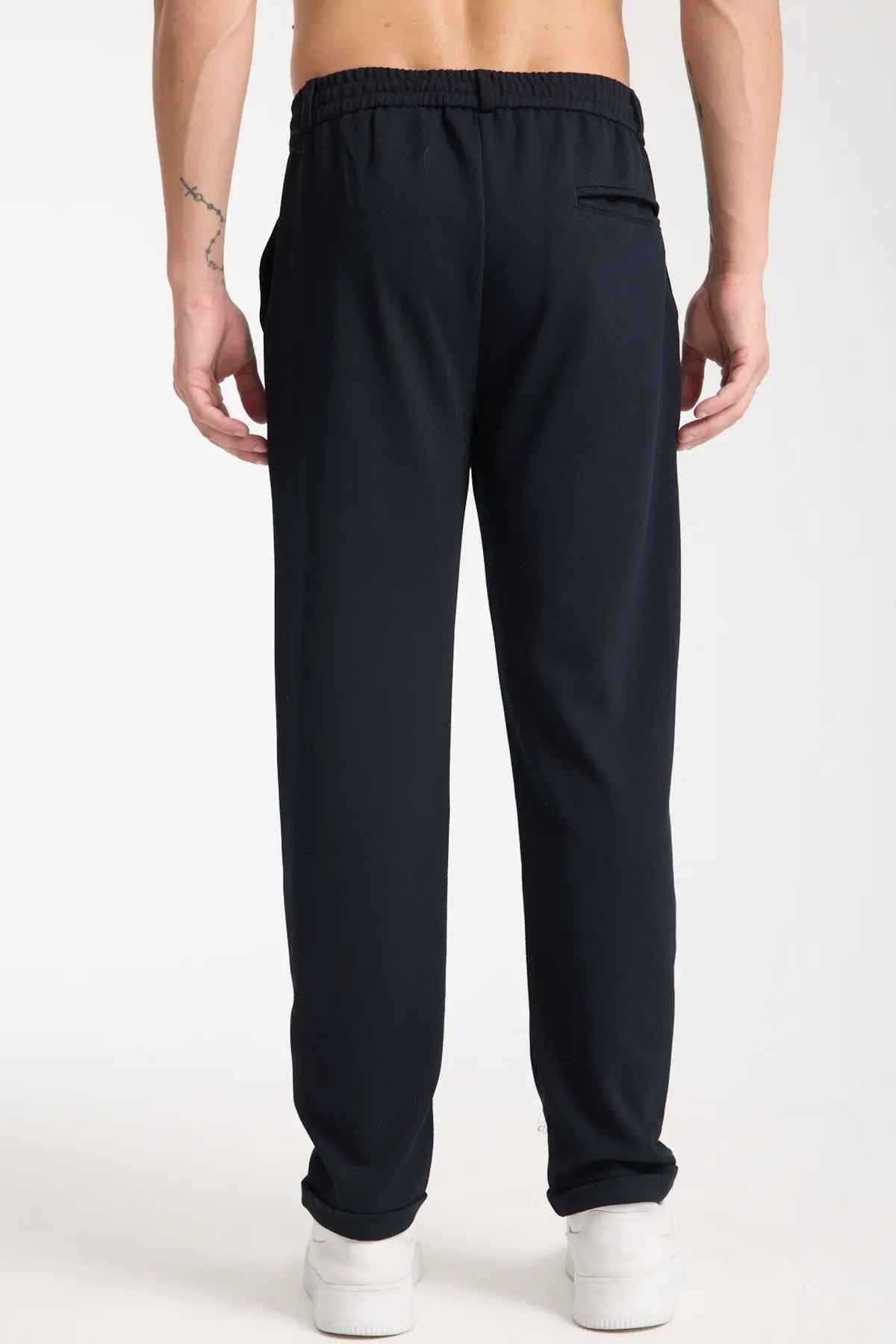 Men's Kaphone dark navy sweatpants with elastic waistband, side seams, and cuffed hems