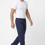 Men's Veleno navy track pants with drawstring waist, side pockets, and tapered legs