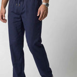 Men's Veleno navy track pants close-up of drawstring waistband and front leg seams