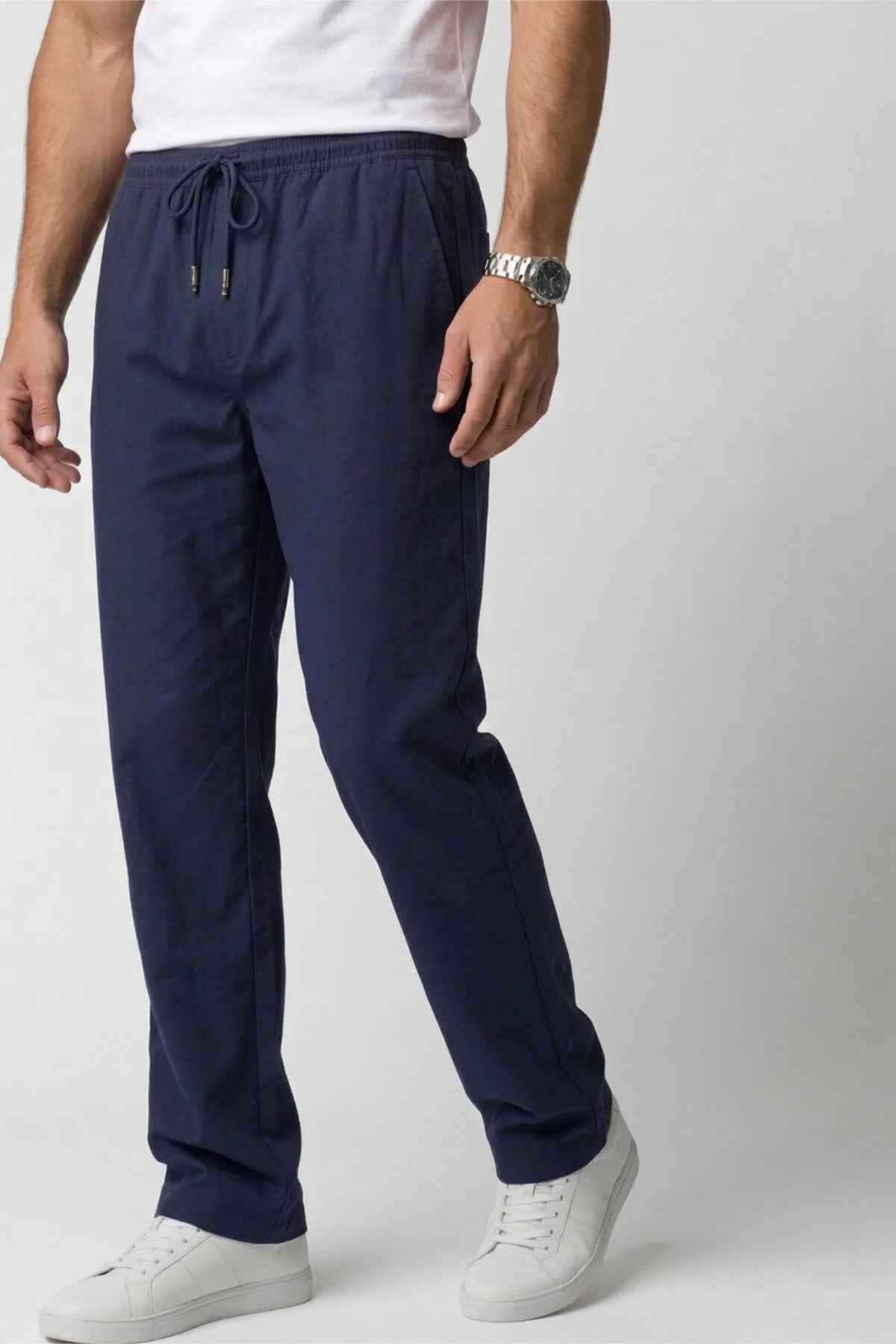 Men's Veleno navy track pants close-up of drawstring waistband and front leg seams