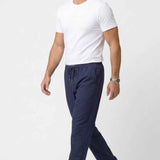 Men's Veleno navy track pants with elastic waistband, drawstring, and ankle cuffs