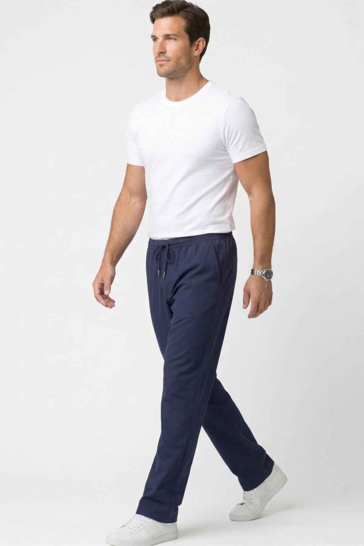 Men's Veleno navy track pants with elastic waistband, drawstring, and ankle cuffs