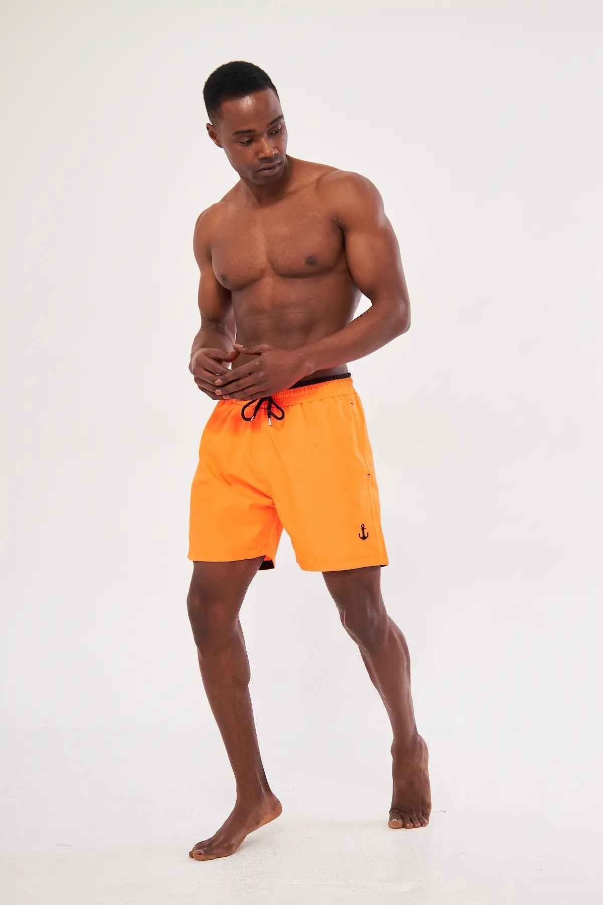 Men's orange swim shorts with black drawstring, above-knee front view