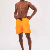 Men's orange swim shorts with black drawstring, standing front view