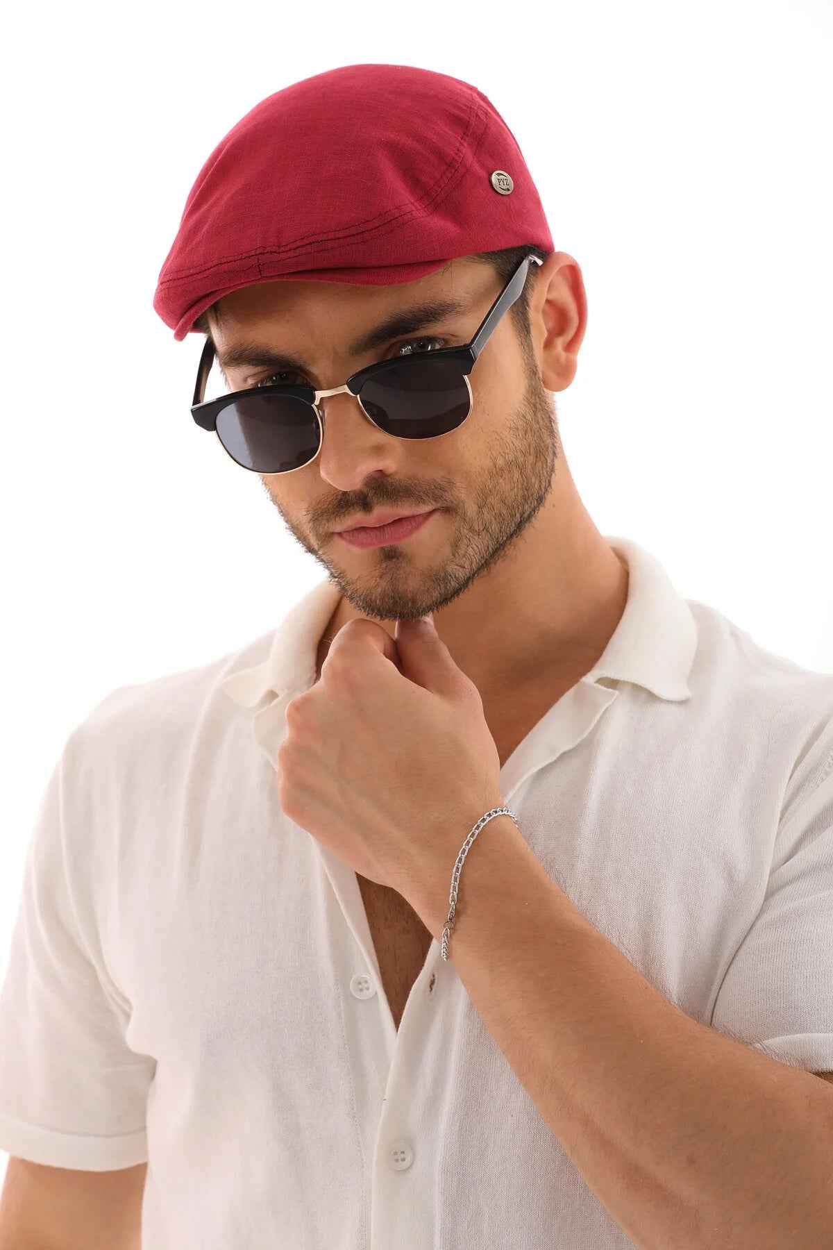Men's red flat cap with green side pin logo
