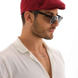 Men's red flat cap with curved brim and side profile