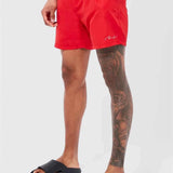Red swimming shorts with white drawstring and elastic waistband