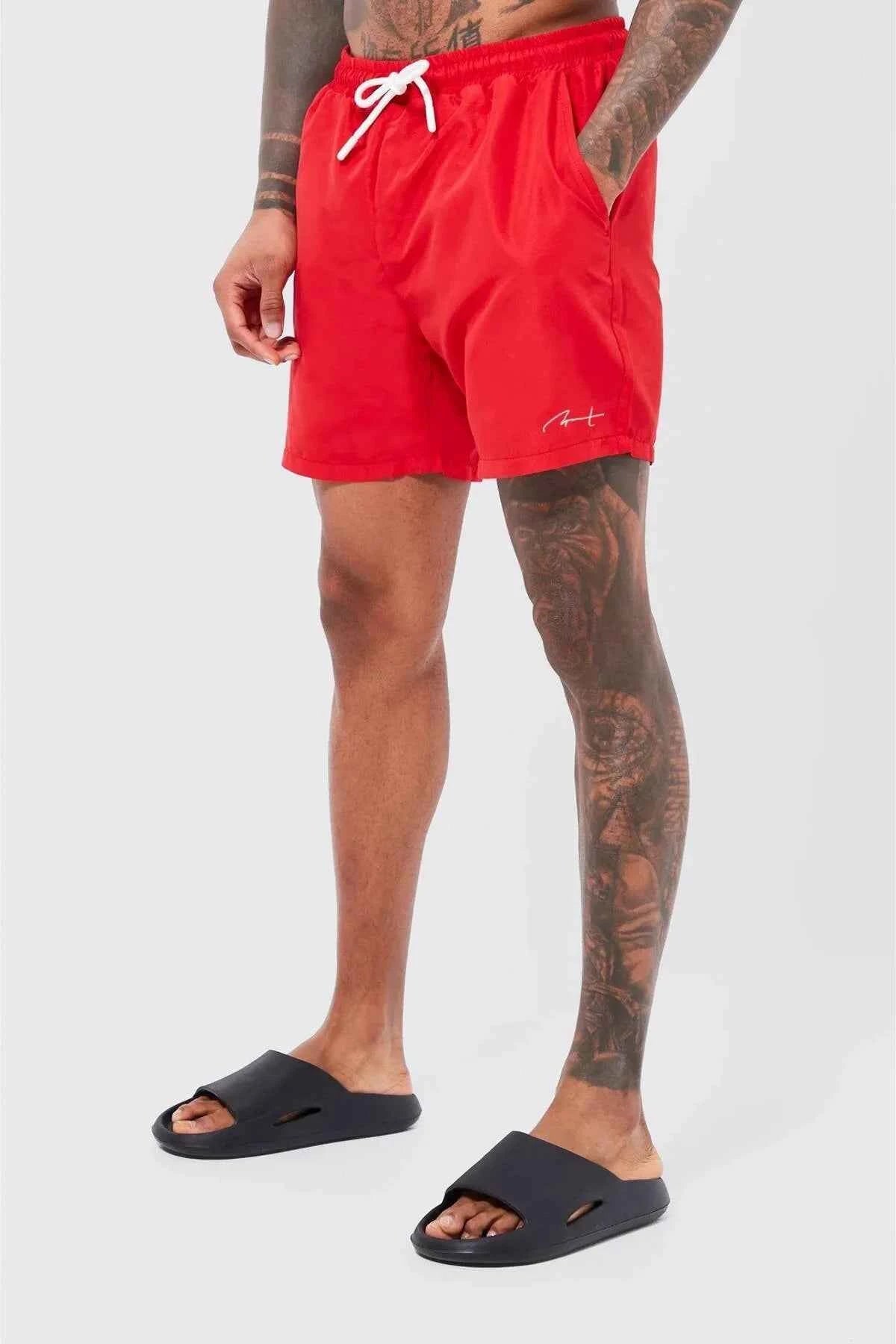 Red swimming shorts with white drawstring and elastic waistband