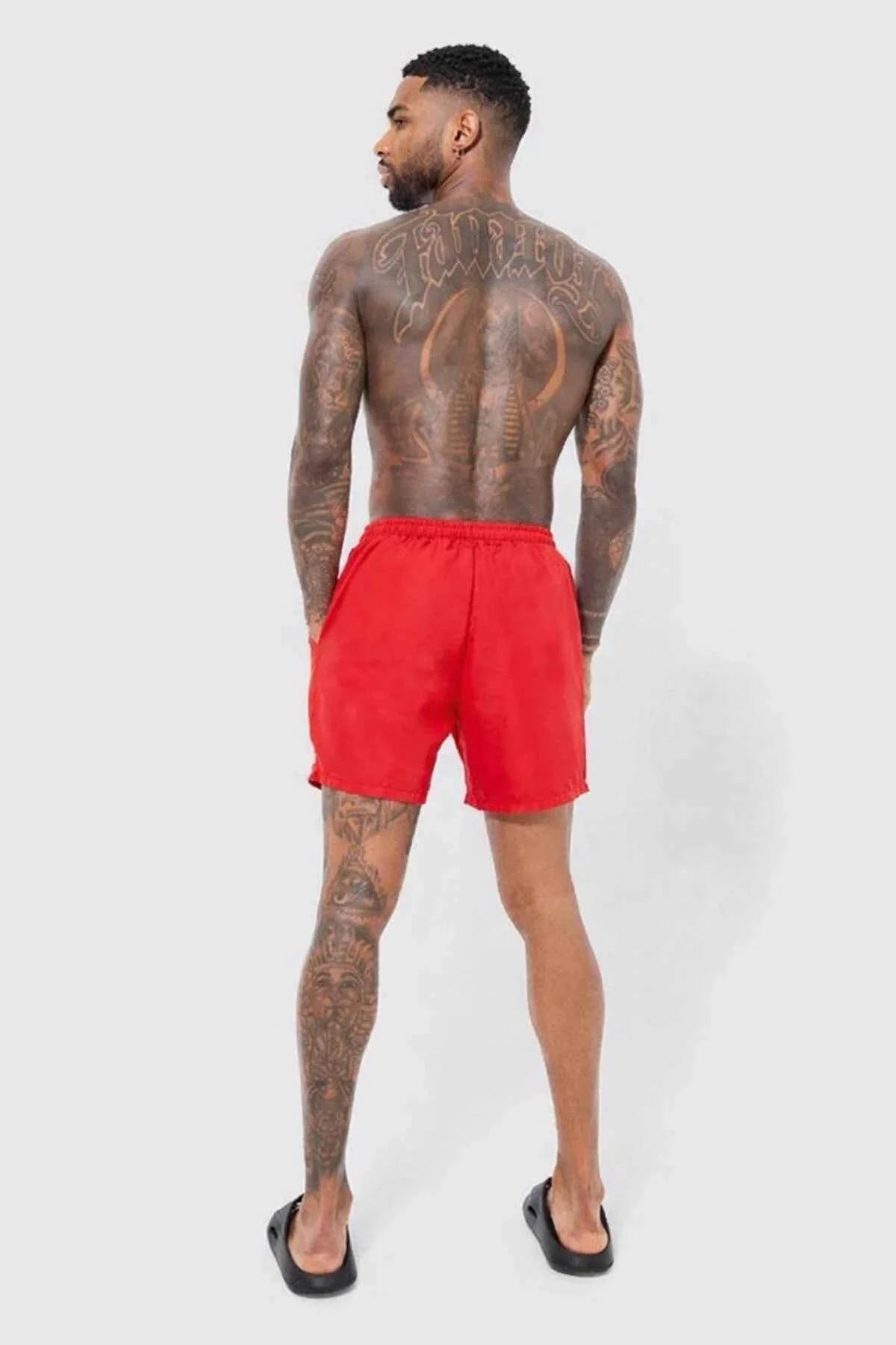 Red swimming shorts, back view, elastic waistband and drawstring ties